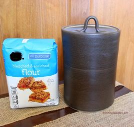Extra Large Pottery Canister along with a 5lbs bag of flour