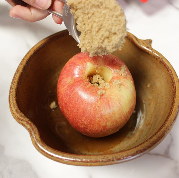 Handmade Pottery Apple Baker with apple and brown sugar